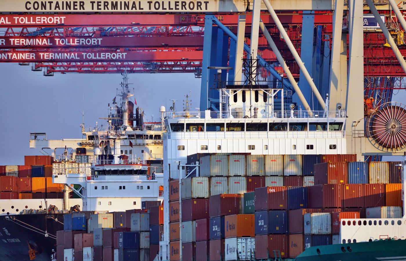 Container ships and cranes at a busy port.
