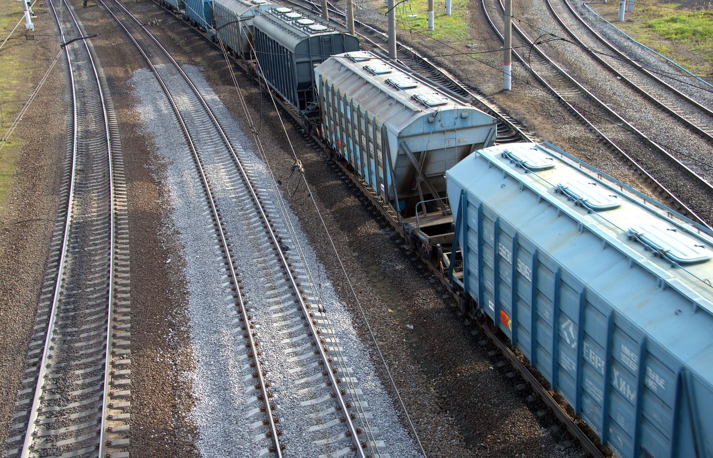 Grain hopper wagons standing in a railway yard, seen from above.